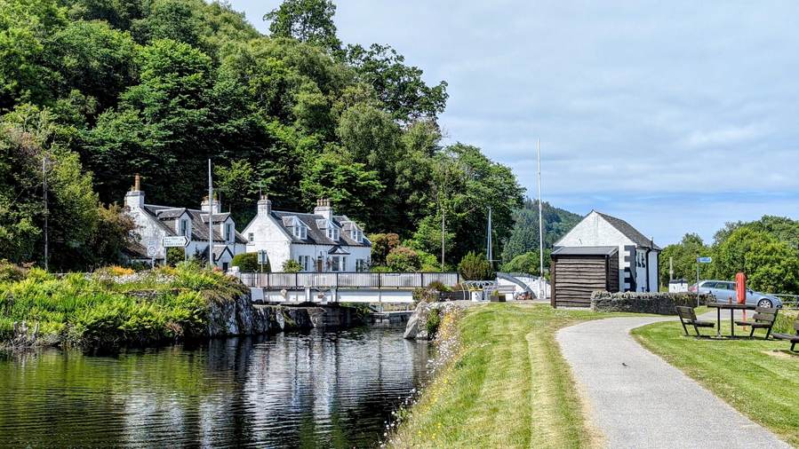An ivy-covered passage beside the canal at Crinan village