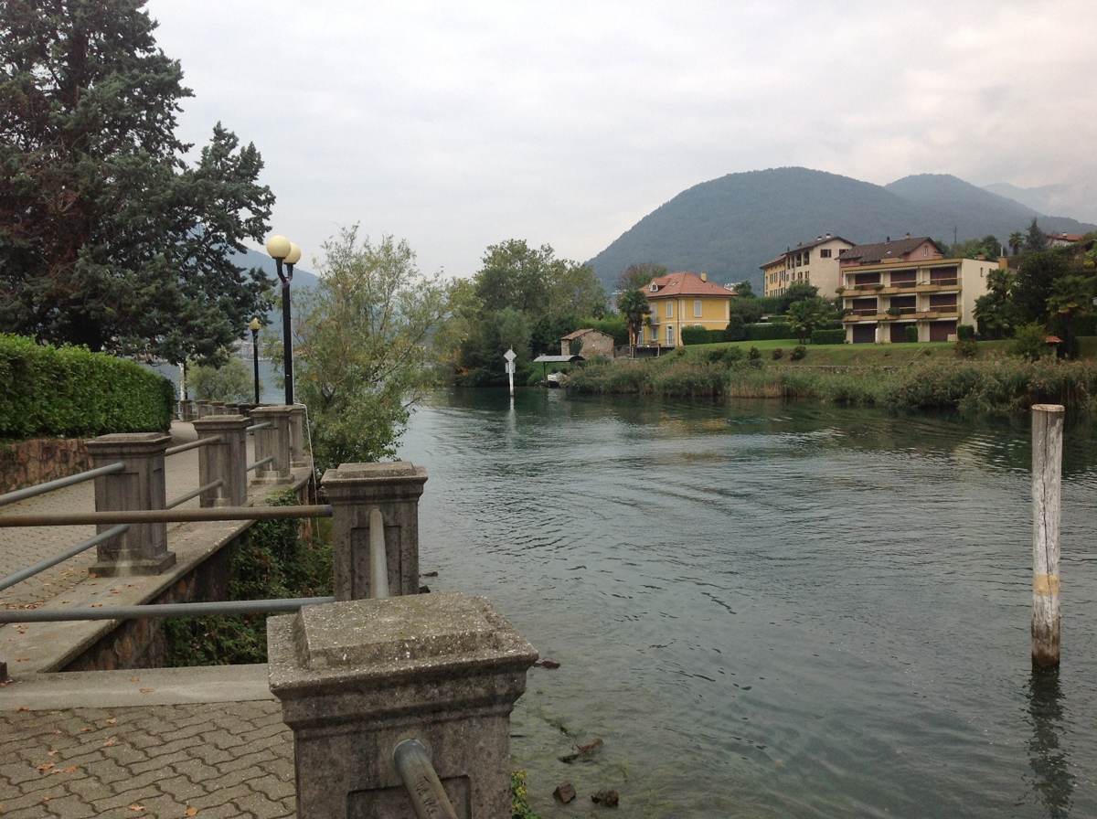 View of the Tresa river and Lake Lugano at Ponte Tresa, on the Swiss-Italian border