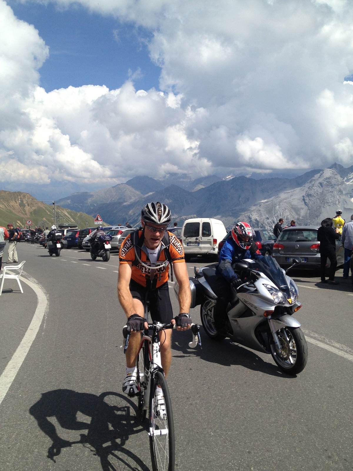 Kevin riding up the Stelvio Pass with a support motorbike alongside