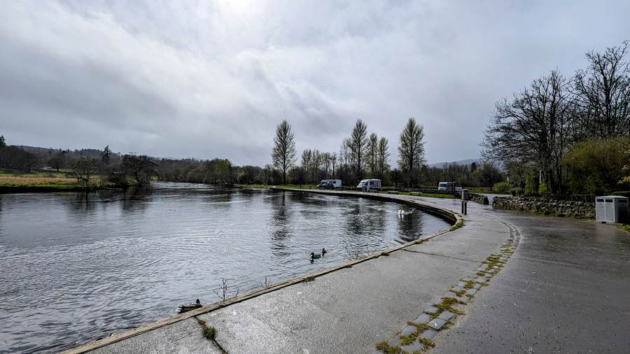 A loch shore path in the Trossachs under a cloudy sky