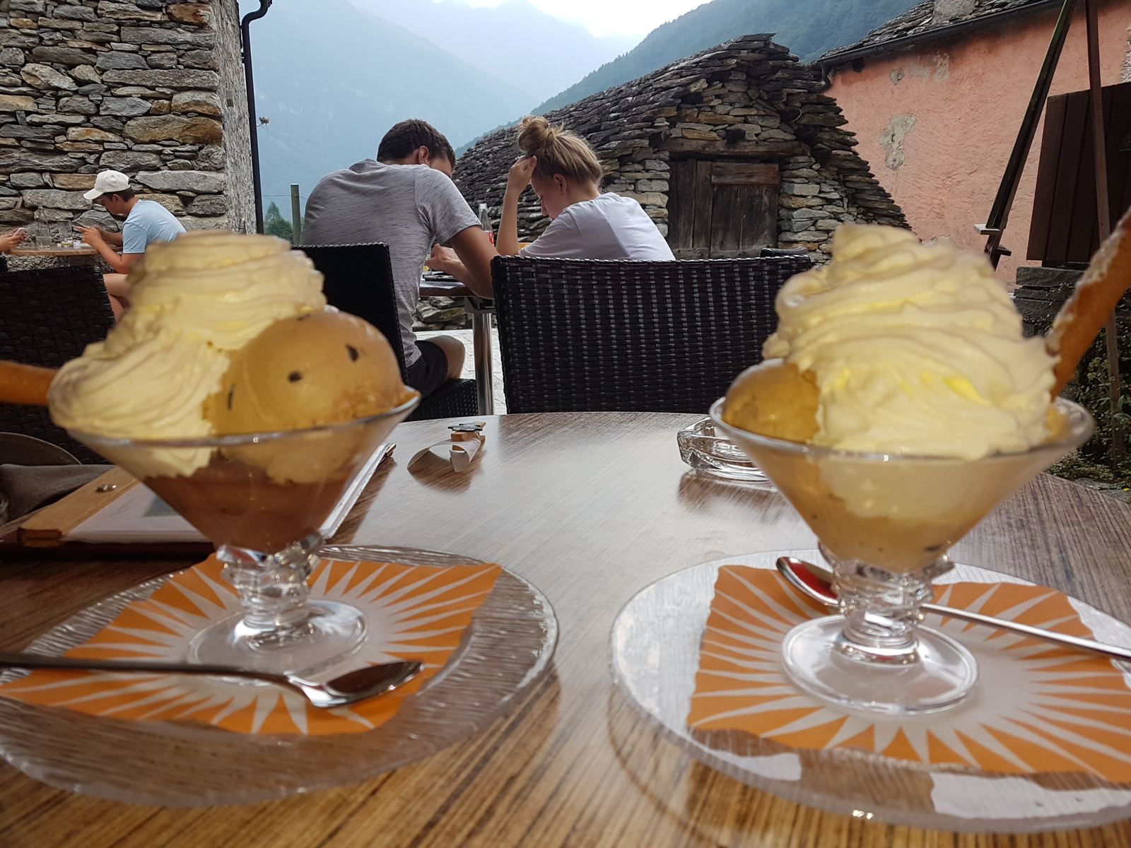 Ice cream sundaes on a café table in a stone village in the Verzasca Valley